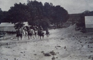 Horseback riders going past Livermore Hotel