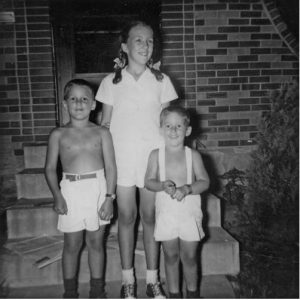 Judith, John and Bill Stenzel in front of their Kansas City home in 1949.